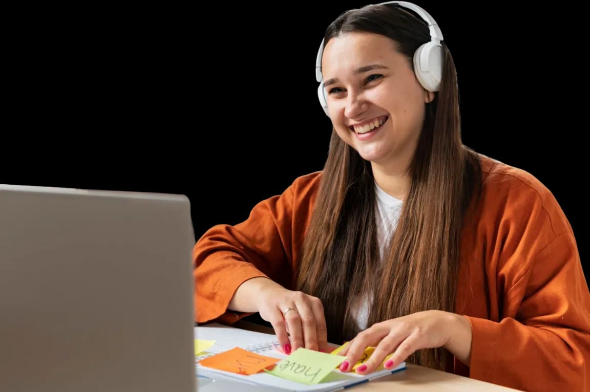 Student smiling while studying in an online tutoring session